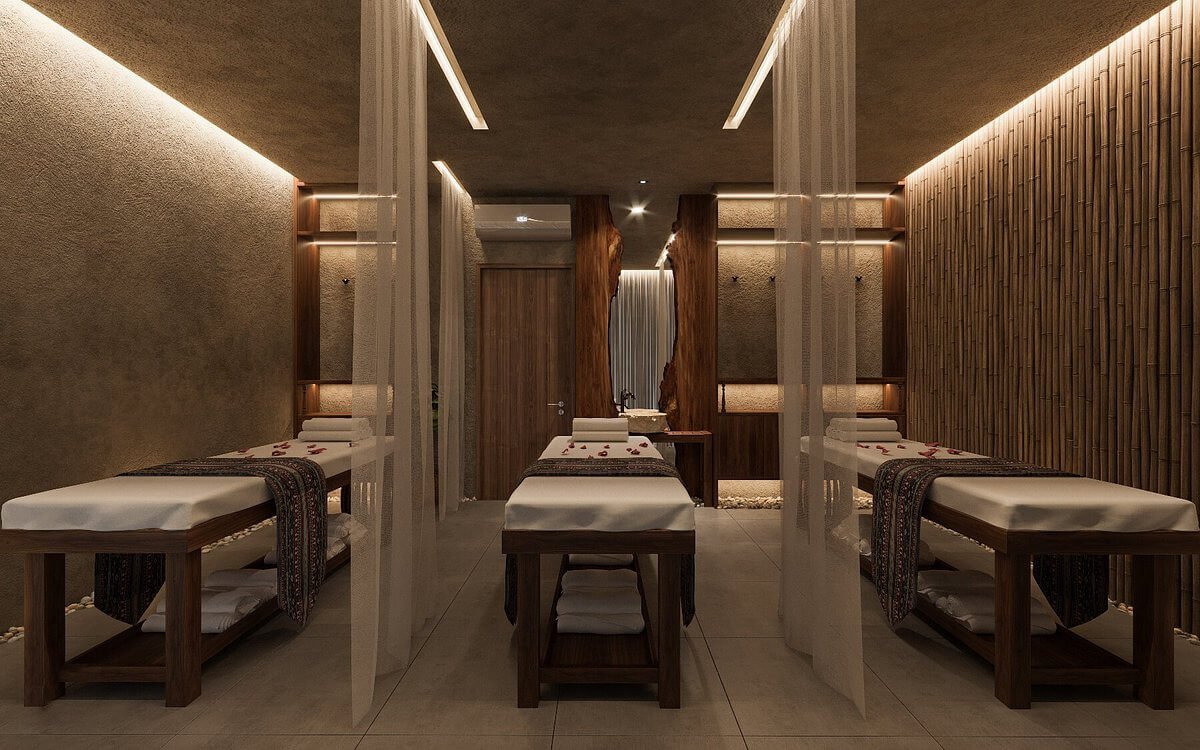 Phòng massage hiện đại với giường gỗ và ánh sáng dịu nhẹ, tạo không gian thư giãn và sang trọng.
