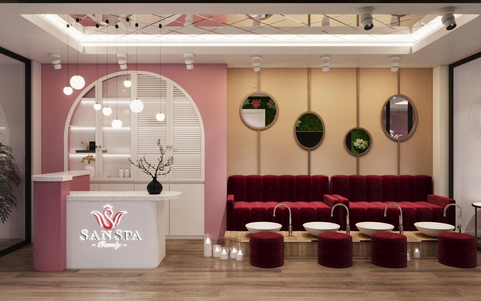 Khu vực tiếp khách spa với ghế đỏ, bàn lễ tân trắng, đèn treo và gương trang trí trên tường.