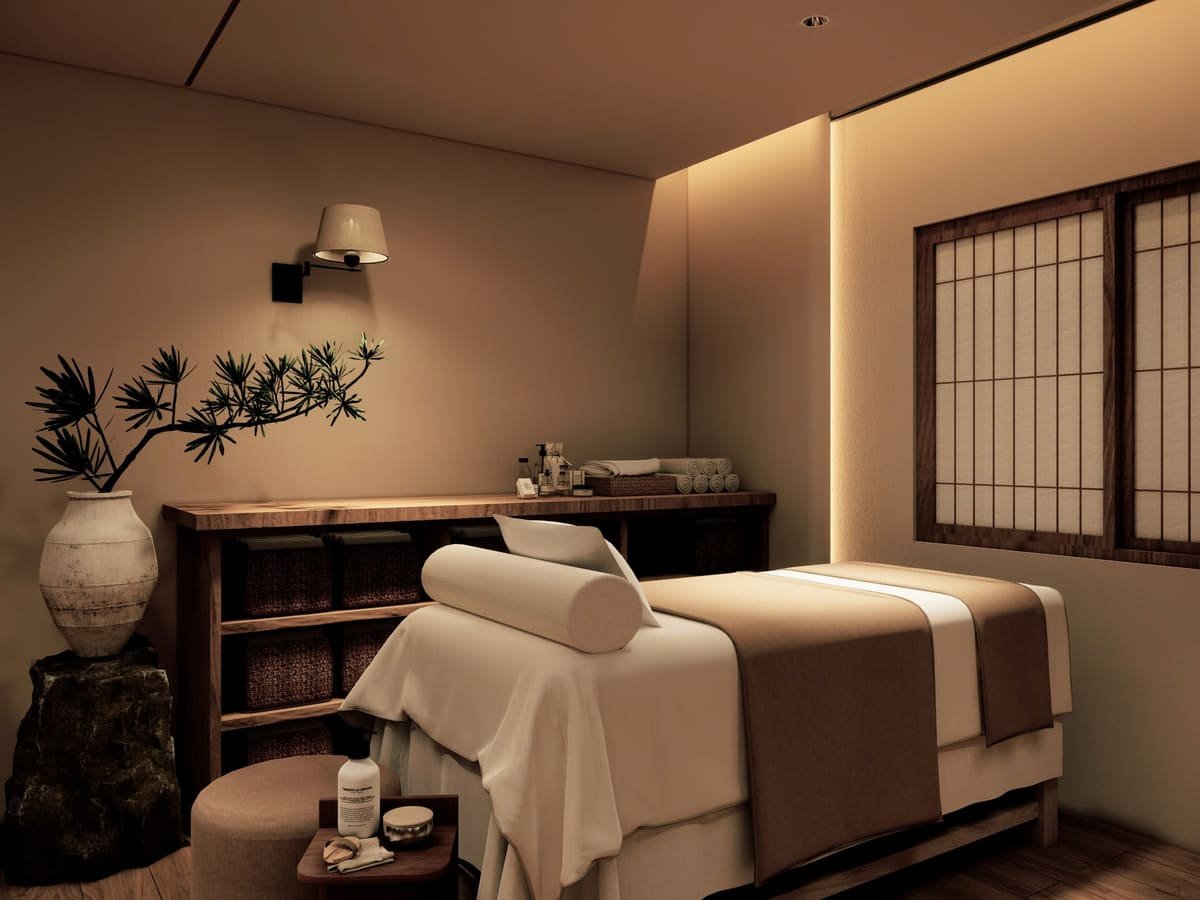 Phòng spa thư giãn với giường massage, ánh sáng ấm áp, và trang trí nội thất hiện đại, sang trọng.