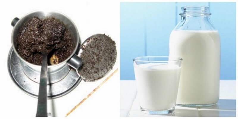 Phin cà phê với bột cà phê bên cạnh chai và ly sữa trên nền sáng.